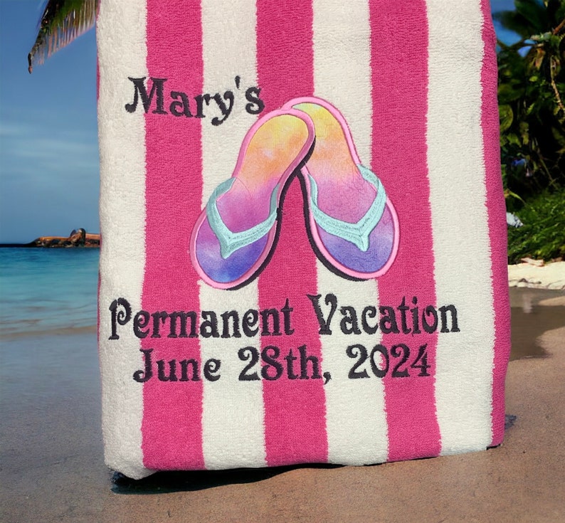 May include: A beach towel with alternating pink and white stripes. The towel features embroidered text that reads "Mary's" and "Permanent Vacation June 28th, 2024". A pair of colorful flip-flops are embroidered on the towel.