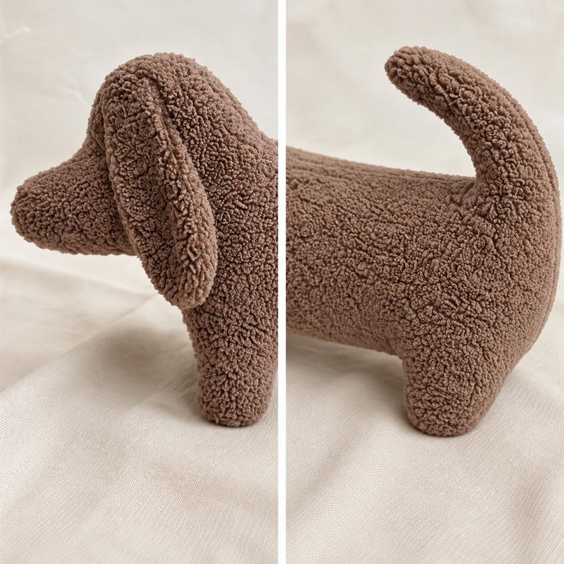 May include: A brown plush dog toy made of textured, curly fabric. The toy features a long body, a rounded head with a long, floppy ear, and a curved tail. The design is segmented into two parts, showing the front section and the rear section.