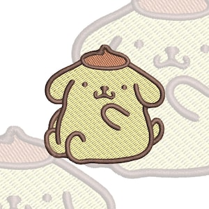 May include: An embroidered patch featuring a light yellow cartoon dog character with a brown beret. The design includes dark brown outlines, two small black eyes, a small nose, and a curved mouth. The character has floppy ears and a small tail.