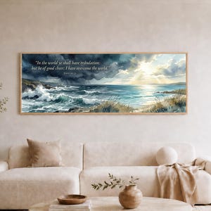 May include: A panoramic wall art print featuring a watercolor seascape with dark storm clouds on the left and bright sunlight breaking through on the right. The text reads: In the world ye shall have tribulation: but be of good cheer; I have overcome the world. John 16:33.
