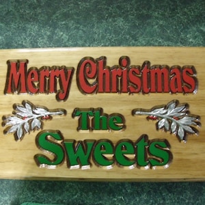 Custom carved Christmas plaque with family name.