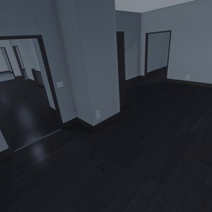 Op de afbeelding: Een interieur van een lege kamer met een donkere houten vloer en lichtgrijze muren. De ruimte bevat meerdere deuropeningen naar aangrenzende kamers, donkere plinten en een witte lichtschakelaar gemonteerd op een centraal muurgedeelte.