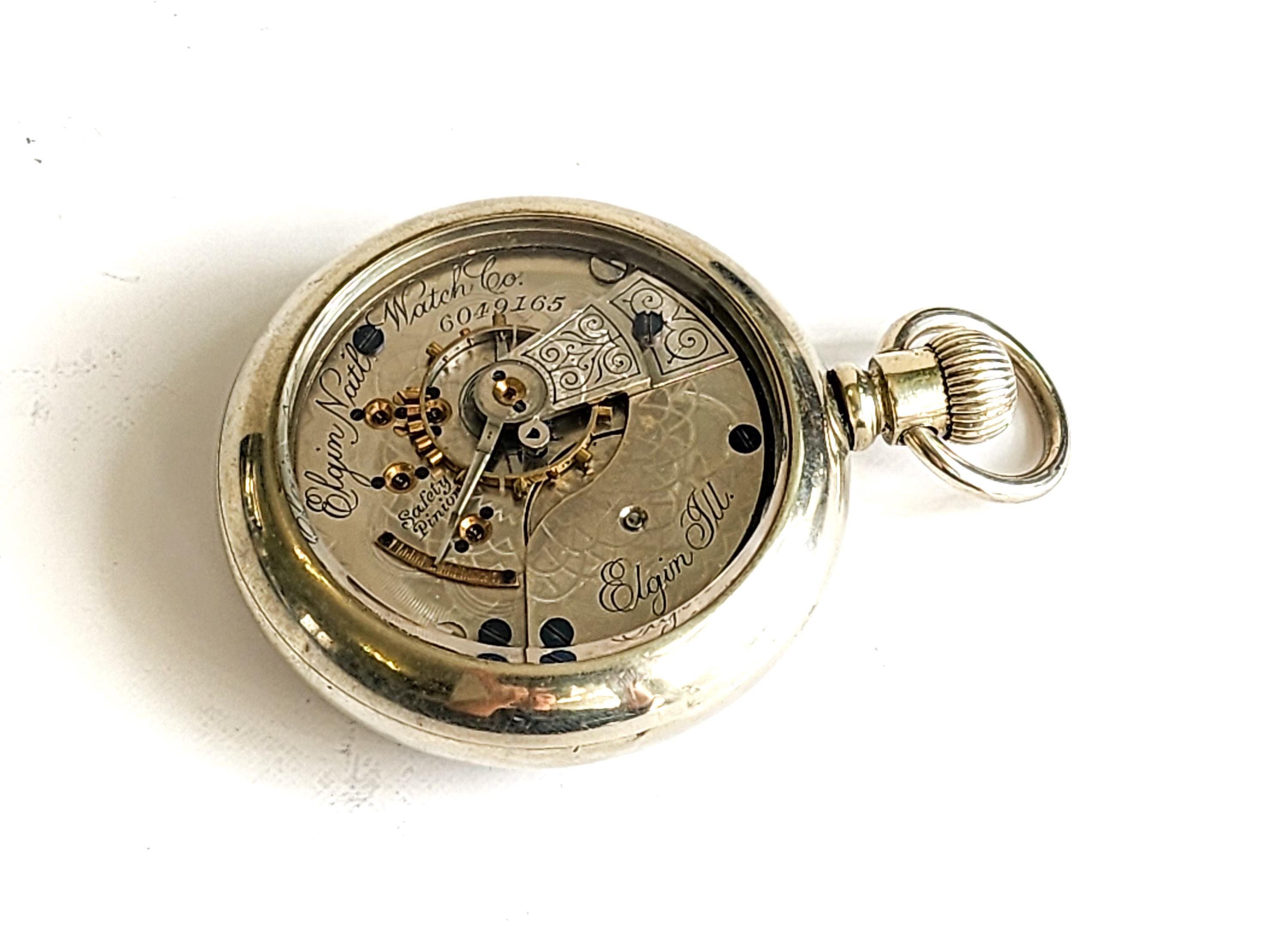 Antico, revisionato, orologio da tasca Elgin con finestra