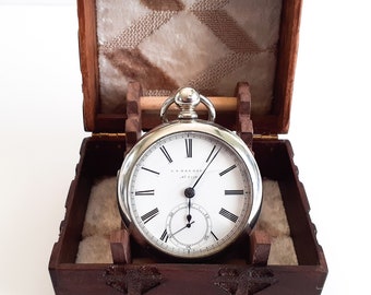 Antique, Serviced, Collectable Swiss fake Waltham Model 1857, with a wood box and stand.