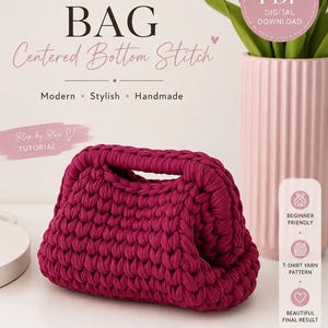 May include: A crochet pattern for a clutch bag with text reading CROCHET PATTERN CLUTCH BAG Centered Bottom Stitch. The image displays a dark magenta, thick-yarn, hand-crocheted clutch bag with a structured handle and a textured, looped stitch design.