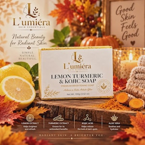 May include: A rectangular bar of L'umiéra Lemon Turmeric & Kojic Soap with a net weight of 100g (3.52 oz). The packaging features the brand name, product name, and icons for lemon extract, turmeric extract, kojic acid, and aloe vera ingredients.