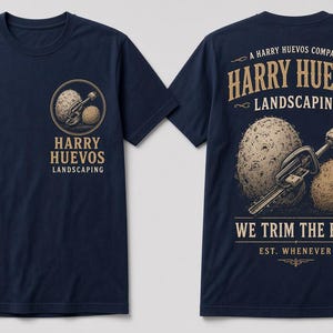 May include: A navy blue short-sleeve t-shirt featuring a small circular logo on the front left chest and a large graphic on the back. The design includes two textured spheres, a hedge trimmer, and the text Harry Huevos Landscaping We Trim The Bush.