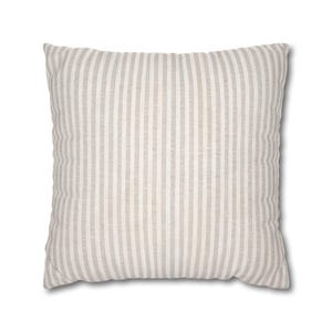 A square beige pillow with fine white vertical stripes on a plain white background.