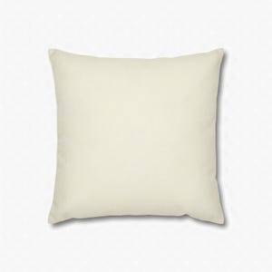 Solid warm ivory square pillow cover on a plain white background