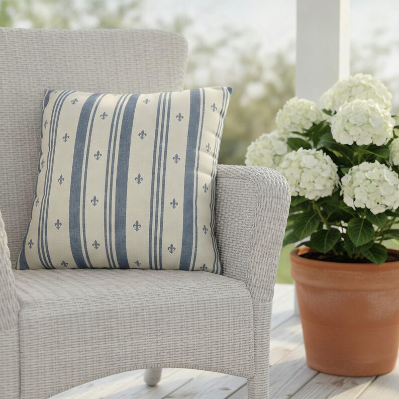 Slate blue fleur de lis ticking stripe pillow styled in a French cottage home