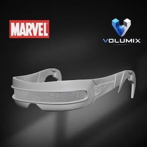May include: A matte gray visor-style eyewear piece featuring a textured mesh front panel and angular side arms. The image includes the Marvel logo in red and white, and the Volumix logo in blue, white, and black text above the eyewear.