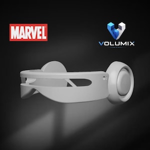 May include: A light gray, smooth, curved visor-style headpiece with circular side components. The image features the red Marvel logo in the top left corner and the blue and white Volumix logo in the top right corner against a dark background.
