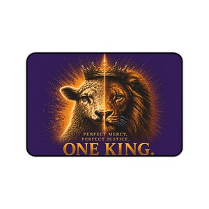 May include: A rectangular mat featuring a split-face image of a lamb and a lion wearing a single crown. The background is deep purple with a golden glow. Text reads: PERFECT MERCY. PERFECT JUSTICE. ONE KING. The design is centered and symmetrical.