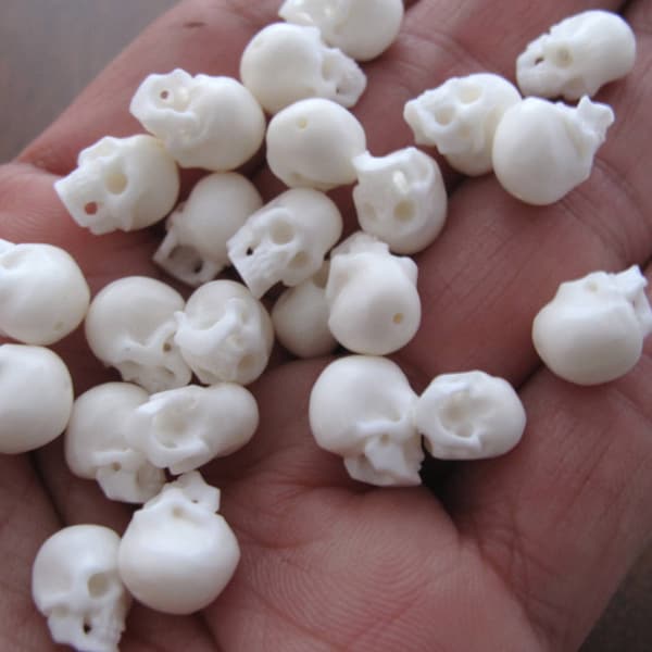 Pair of 10 mm Amazing detail  tiny buffalo Bone skull beads,   top to bottom Drilled  B8018