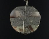 Art Jewelry Pendant, Grey Concrete, Inlaid River Rock, Wrapped in Steel Wire, Hangs on a 20 Silver Silk Cord