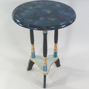 May include: A set of three ceramic nesting bowls in graduating sizes. The bowls feature a speckled, cream-colored exterior and a contrasting dark brown interior. The largest bowl measures approximately 8 inches in diameter.