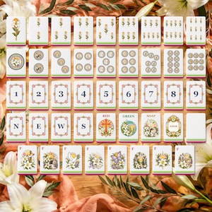 May include: A set of rectangular game tiles featuring floral illustrations, numerical digits one through nine, the letters N, E, W, S, the words RED, GREEN, SOAP, a Joker tile, and various religious-themed imagery including lilies and doves.