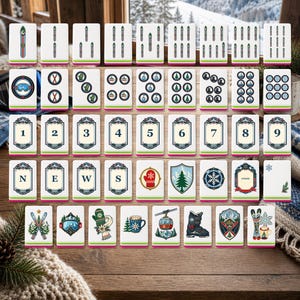 May include: A set of rectangular game tiles featuring winter-themed illustrations including skis, goggles, mittens, pine trees, snowflakes, cable cars, and boots. The tiles also display numbers one through nine, the letters N, E, W, S, and a Joker card.