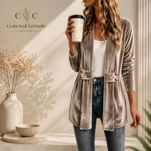 Women’s polyester velvet cardigan in ivory with decorative gold buttons, long sleeves, and a mid-length elegant design.
