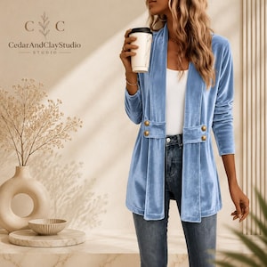 Women’s polyester velvet cardigan in ivory with decorative gold buttons, long sleeves, and a mid-length elegant design.