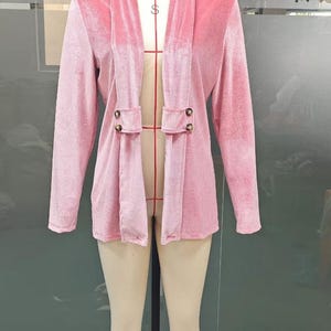 Women’s polyester velvet cardigan in ivory with decorative gold buttons, long sleeves, and a mid-length elegant design.