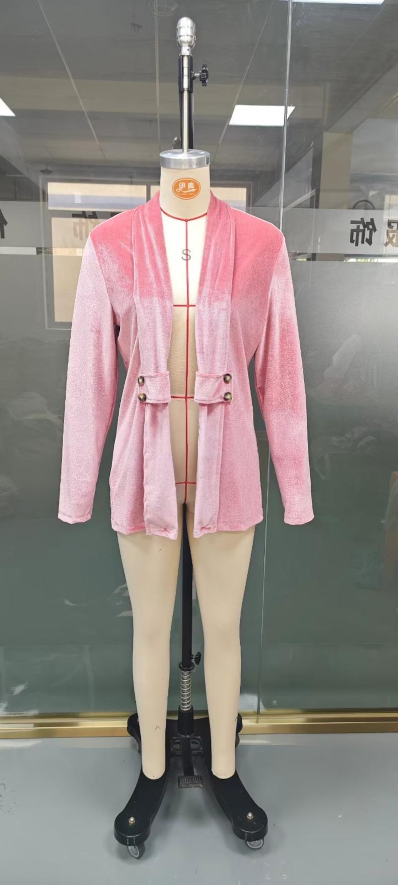 Women’s polyester velvet cardigan in ivory with decorative gold buttons, long sleeves, and a mid-length elegant design.