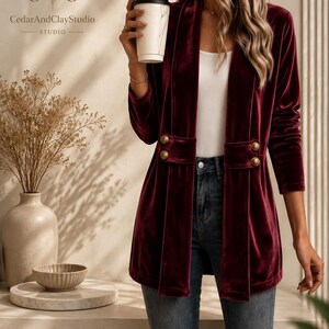Women’s polyester velvet cardigan in ivory with decorative gold buttons, long sleeves, and a mid-length elegant design.