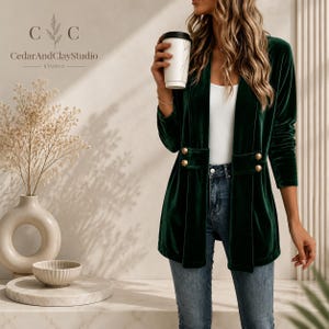 Women’s polyester velvet cardigan in ivory with decorative gold buttons, long sleeves, and a mid-length elegant design.