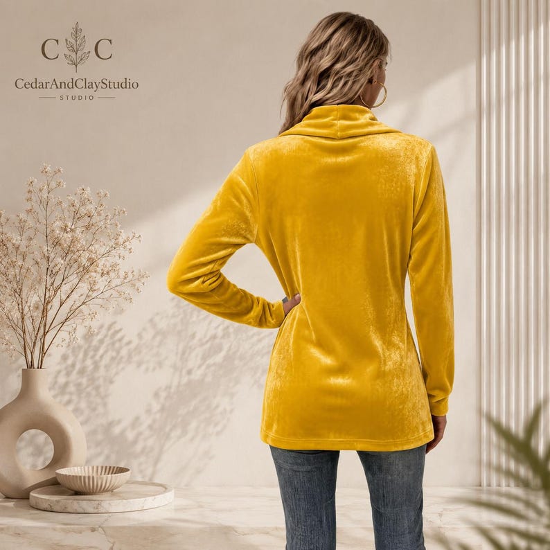 Women’s polyester velvet cardigan in ivory with decorative gold buttons, long sleeves, and a mid-length elegant design.