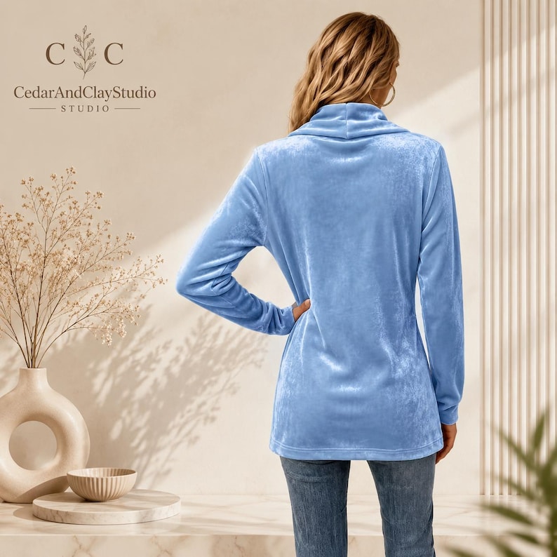 Women’s polyester velvet cardigan in ivory with decorative gold buttons, long sleeves, and a mid-length elegant design.