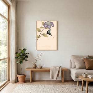May include: A rectangular wall art print featuring a botanical illustration of a purple hydrangea flower cluster and a dark blue butterfly on a light cream background, with a small red stamp mark on the lower right side of the artwork.