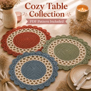 May include: Three round crochet placemats in rust, sage green, and dusty blue, each featuring a solid center, a cream-colored openwork lattice border, and a scalloped edge. The text Cozy Table Collection PDF Pattern Included is visible.