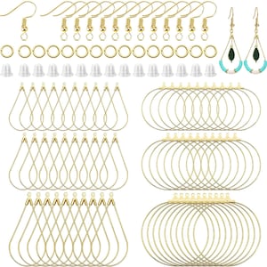 May include: A jewelry making kit containing gold-toned earring hooks, jump rings, clear silicone earring backs, teardrop-shaped wire earring frames, and circular wire earring frames, plus one pair of finished earrings with green and turquoise beads.