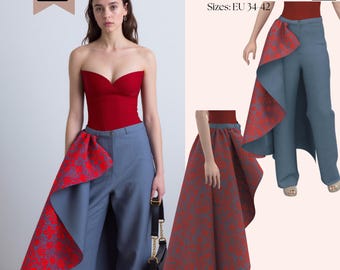 May include: A PDF pattern for trousers featuring a high-waisted design with a dramatic, floor-length side drape. The trousers are blue with a red floral pattern on the interior of the drape. Text includes SAVI Studio PDF Pattern Sizes: EU 34-42.
