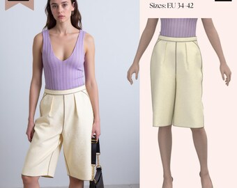 May include: A digital sewing pattern for knee-length, cream-colored culottes with a high waist, front pleats, and visible dark stitching. The pattern is labeled SAVI Studio PDF Pattern, Sizes: EU 34-42, and includes a visual of the finished garment.