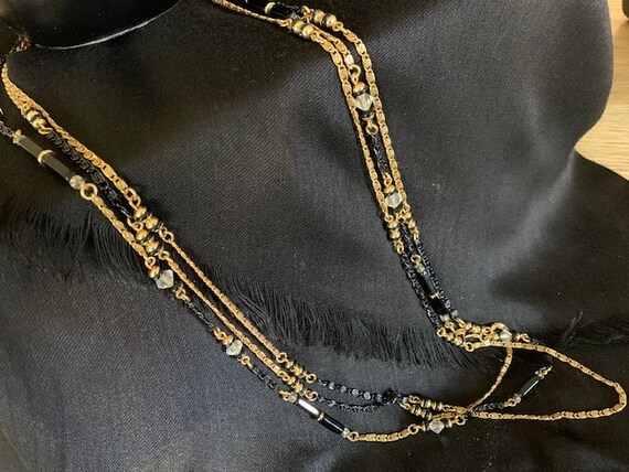 Vintage Gold Tone and Caged Black Beads 24 Inch Necklace with Spring Ring Clasp.