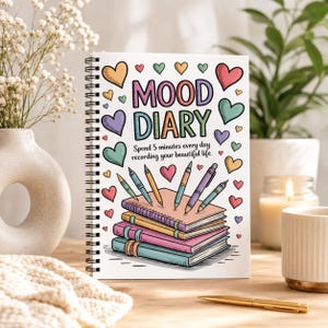 May include: A spiral-bound notebook titled Mood Diary with the text Spend 5 minutes every day recording your beautiful life. The cover features colorful illustrations of hearts, four stacked notebooks, and five pens in various pastel shades.
