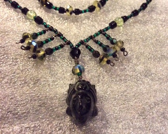 Sale - Vintage Handmade Beaded Necklace with Dark Green Deity Face