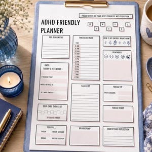 May include: A white ADHD Friendly Planner sheet on a blue clipboard with black text including sections for top 3 priorities, time block plan, energy levels, task list, self-care checklist, brain dump, and end of day reflection, with daily headers.