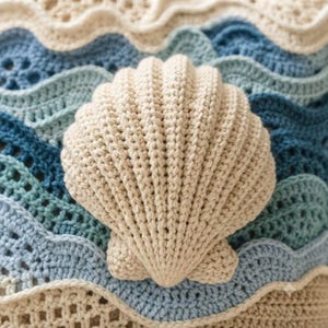 May include: A crochet textile featuring a central three-dimensional beige seashell motif layered over a background of wavy, interconnected patterns in various shades of blue, light blue, and cream, created with intricate yarn stitching techniques.