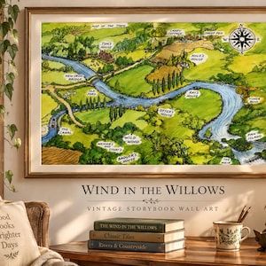 May include: A framed wall art print featuring a detailed, hand-drawn style map of the Wind in the Willows landscape. The illustration depicts a winding blue river, green rolling hills, and labelled locations including Wild Wood and Otter's House.