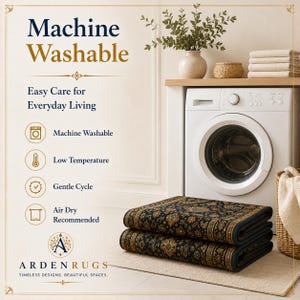 Op de afbeelding: Een gevouwen donkerblauw tapijt met ingewikkelde gouden en oranje bloemmotieven. De tekst luidt: Machine Washable, Easy Care for Everyday Living, Machine Washable, Low Temperature, Gentle Cycle, Air Dry Recommended en ARDEN RUGS.