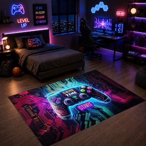 May include: A rectangular area rug featuring a vibrant, neon-coloured graphic of a video game controller set against a dark circuit board pattern. The design includes the text "GAME TIME" and "START" in glowing, multi-coloured lettering.