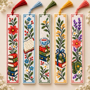 May include: Five rectangular cross-stitch bookmarks with white fabric bases and colored borders. Each features embroidered floral motifs, stacks of books, and a matching tassel at the top in red, light blue, green, yellow, and pink.