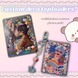 May include: Two rectangular plastic toploaders decorated with colorful charms, beads, and stickers. One toploader features an anime character illustration, while the other displays a smiling character holding a pastry. Text reads custom deco toploaders!