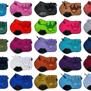 May include: A collection of twenty quilted horse saddle pads and matching ear bonnets in various colors including blue, pink, black, brown, red, green, lime, gray, purple, white, orange, and yellow, each featuring a black reinforced girth patch.