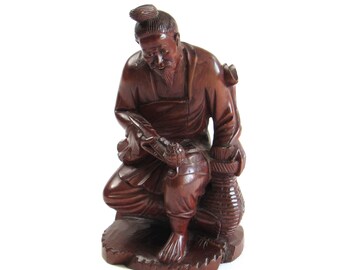 Confucius Style Asian Man with Long Pipe