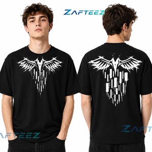 May include: A black short-sleeved t-shirt featuring a white graphic print on the chest and back. The design depicts a stylized pair of wings with vertical rectangular elements extending downward, resembling a falling or dripping effect.