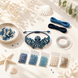 May include: A blue octopus-shaped bracelet featuring intricate beadwork, surrounded by supplies including loose blue and white beads in a ceramic bowl, five small plastic bags of assorted beads, two lengths of blue cord, and clear elastic string.