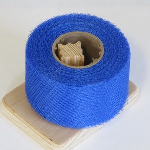 May include: A roll of blue netting on a wooden spool. The netting is a fine mesh and is used for various purposes, such as crafts, gardening, and packaging.